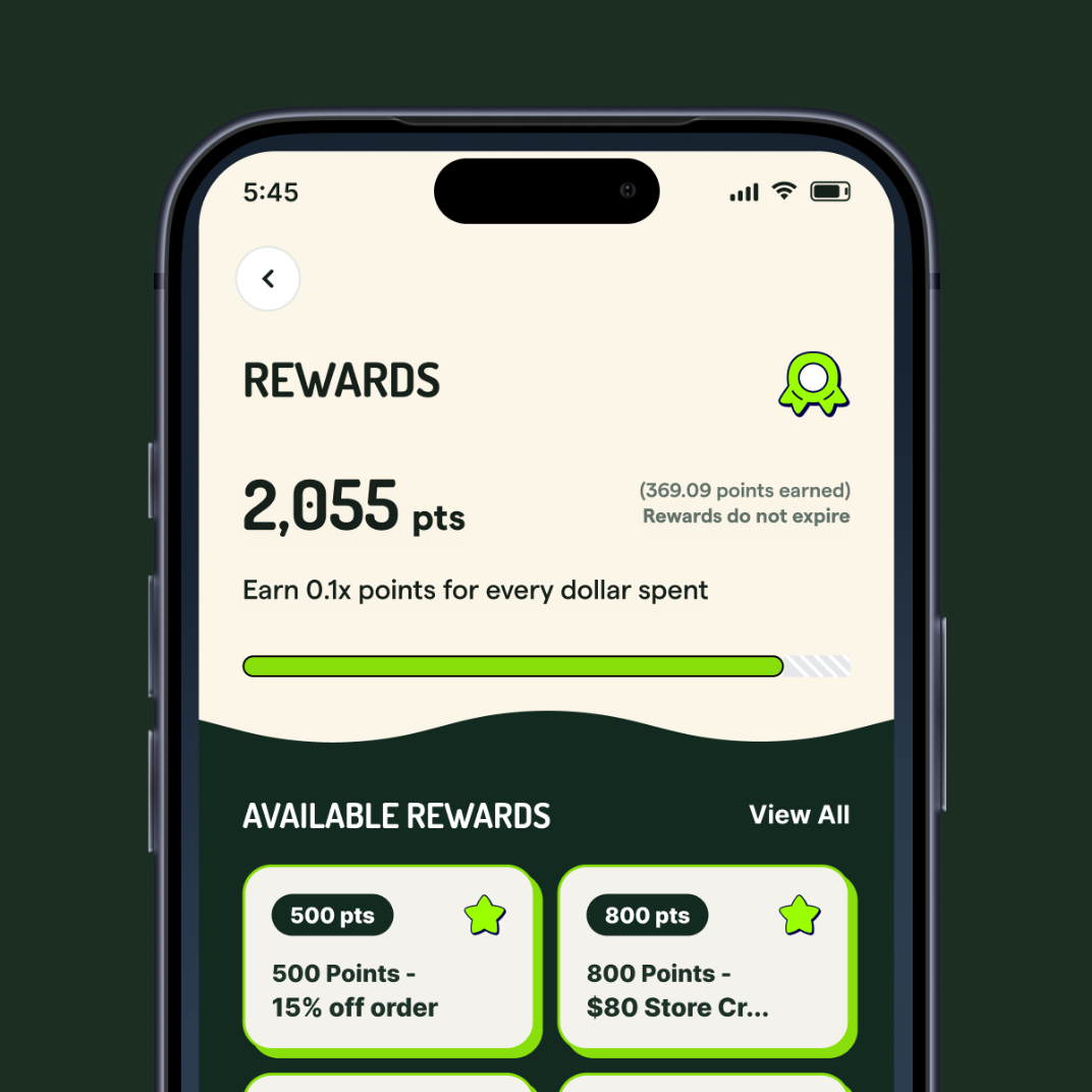 Rewards page showing point balance, points earned, and available rewards redeemable for a discount or store credit